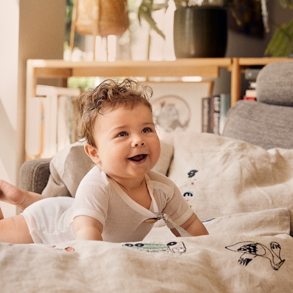 Baby on personalized baby bedding from MinEgen